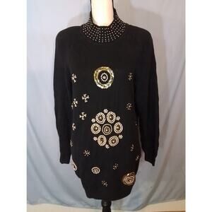 New York Aspects:    Glamorous black and gold sweater.